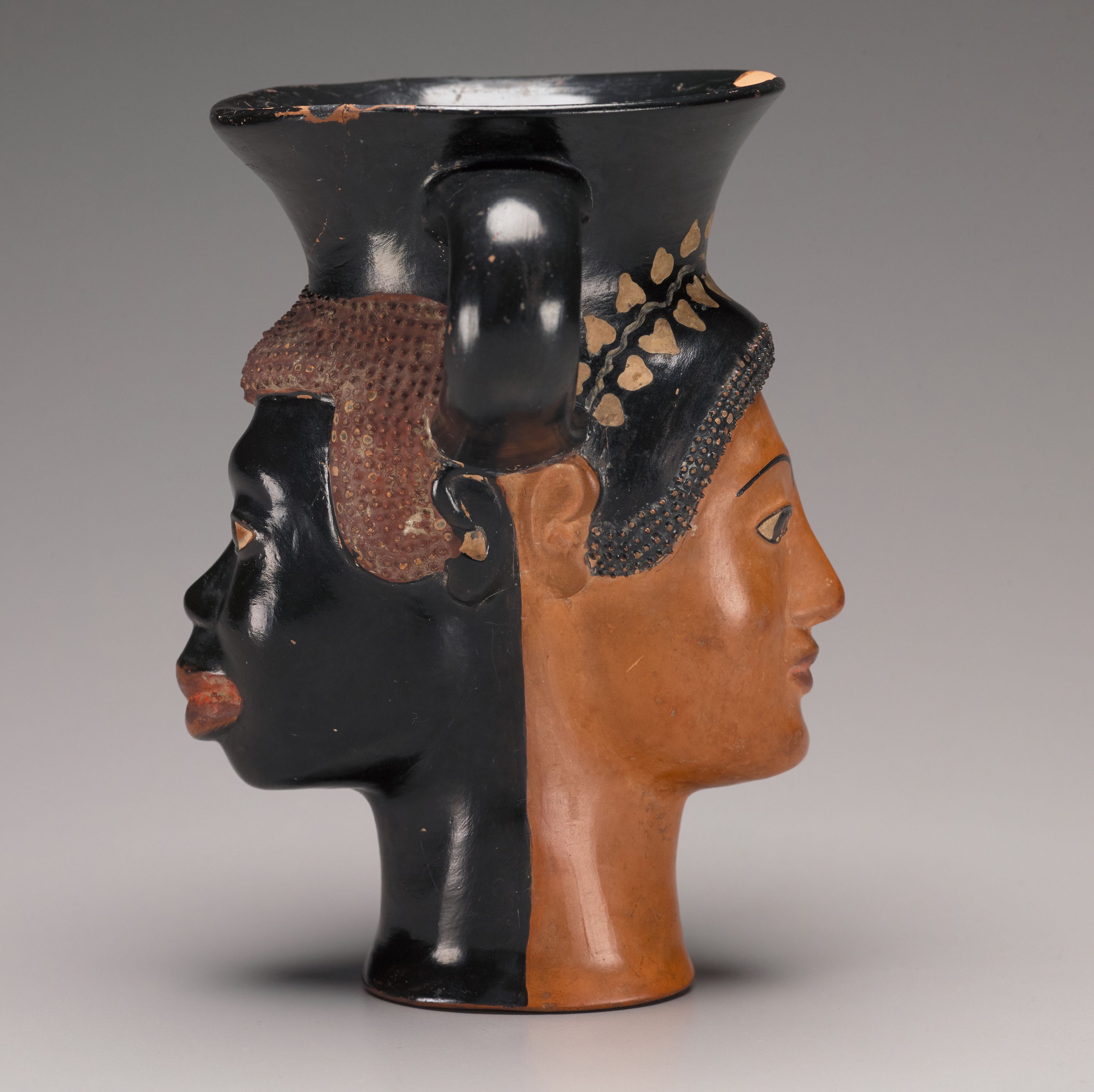 Janiform kantharos with addorsed heads of a male African and a female Greek, ca. 480–470 BCE